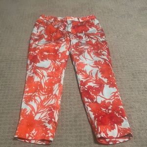 A turquoise and coral color pant.